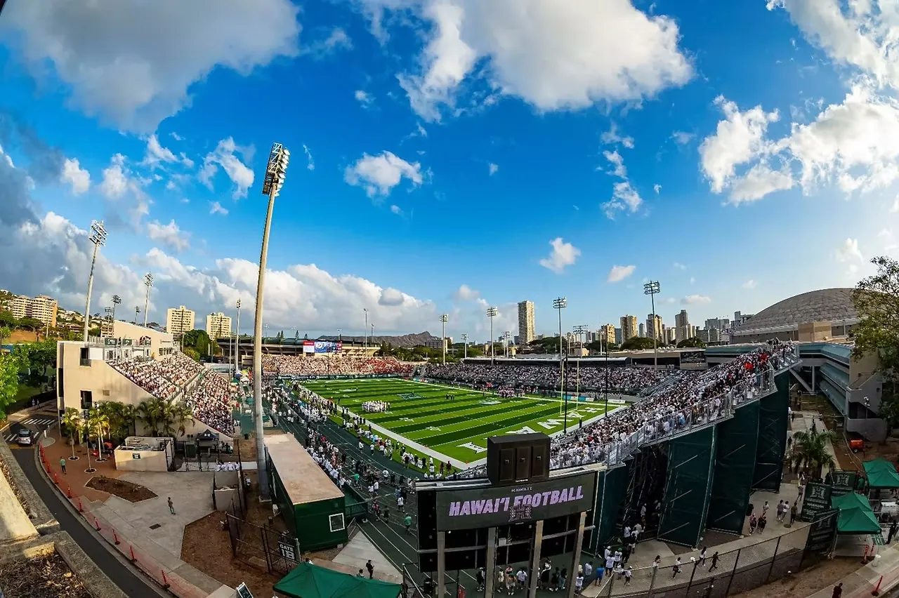 Hawaii football game day at the Clarence T.C. Ching Athletics Complex on Oahu, with the Honolulu skyline and Diamond Head behind the stadium