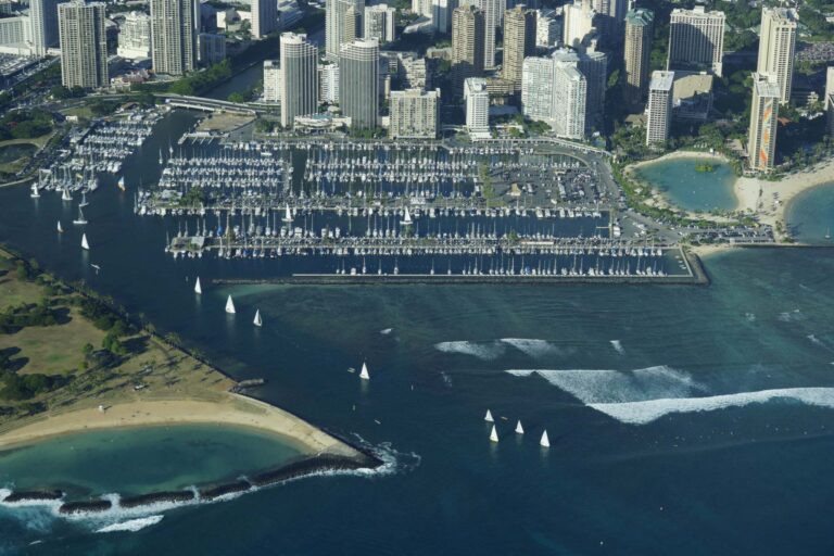 Aerial view of Magic Island, the Ala Wai Boat Harbor, the Prince towers and Duke Kahanamoku Lagoon