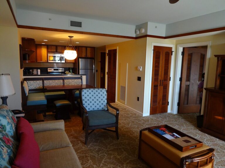 Living room and kitchen of a one-bedroom villa at Aulani