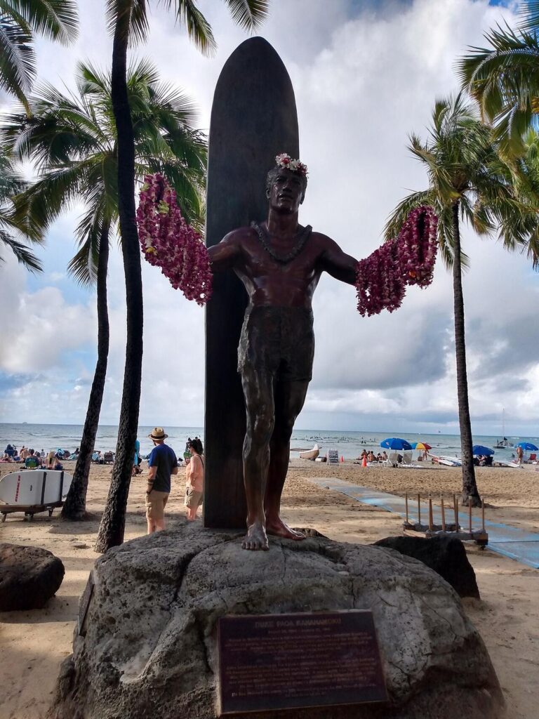 The Duke Kahanamoku statue with lei at Kuhio Beach