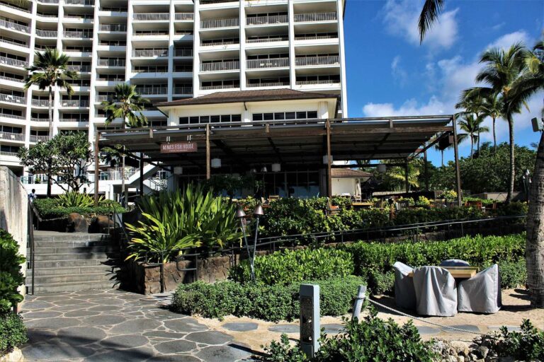 The Mina's Fish House pavilion below the Four Seasons Oahu tower