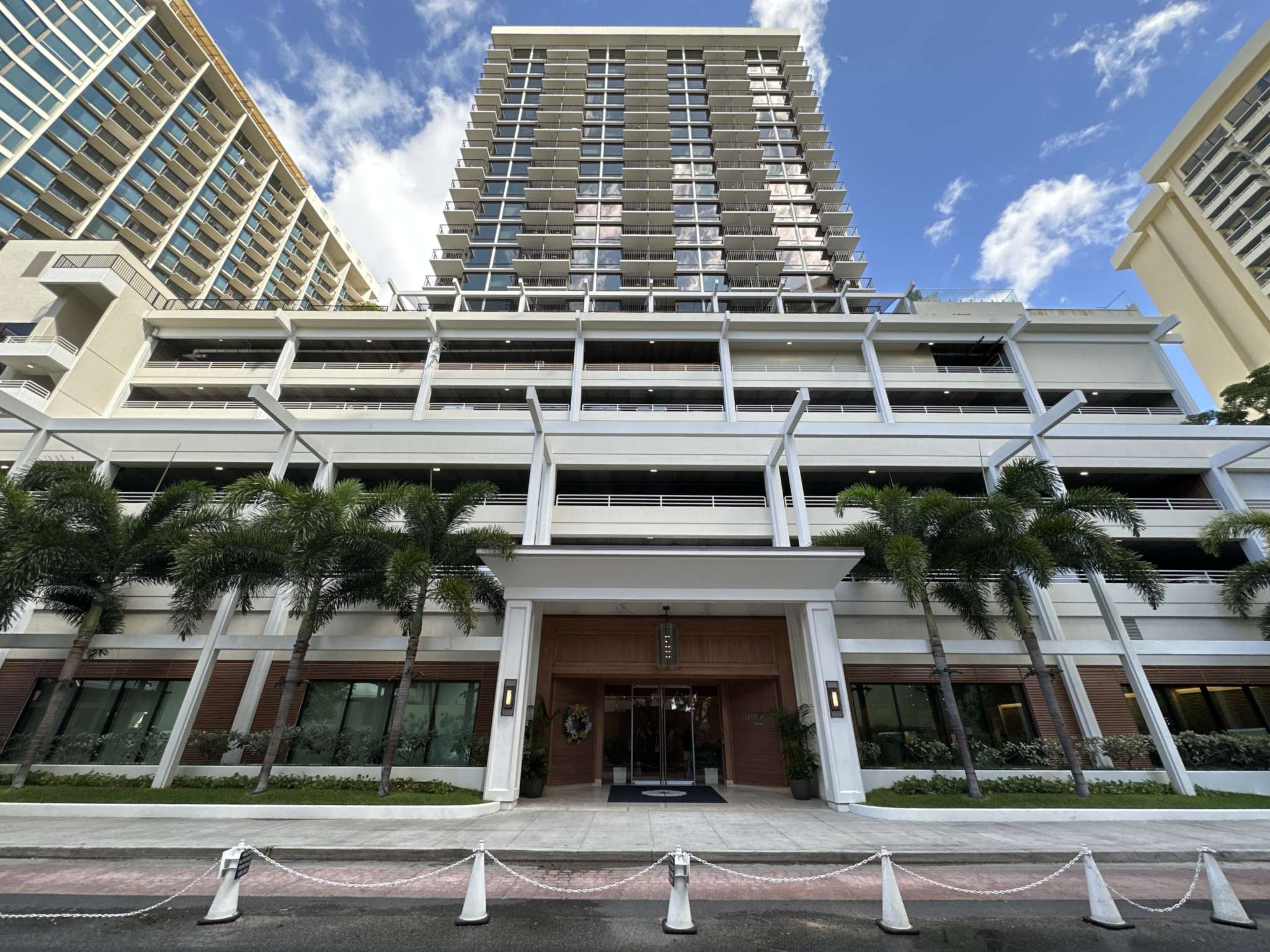 The Halepuna Waikiki by Halekulani tower and entrance on Helumoa Road