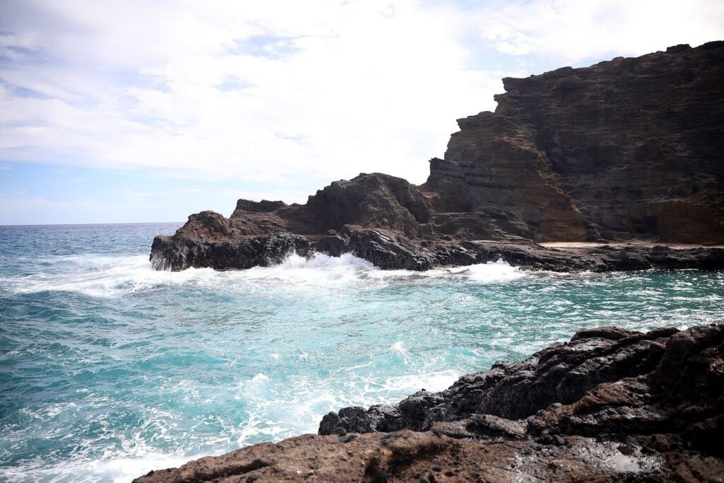 Waves breaking on the lava rock below the Halona Blowhole Lookout on Oahu's east side