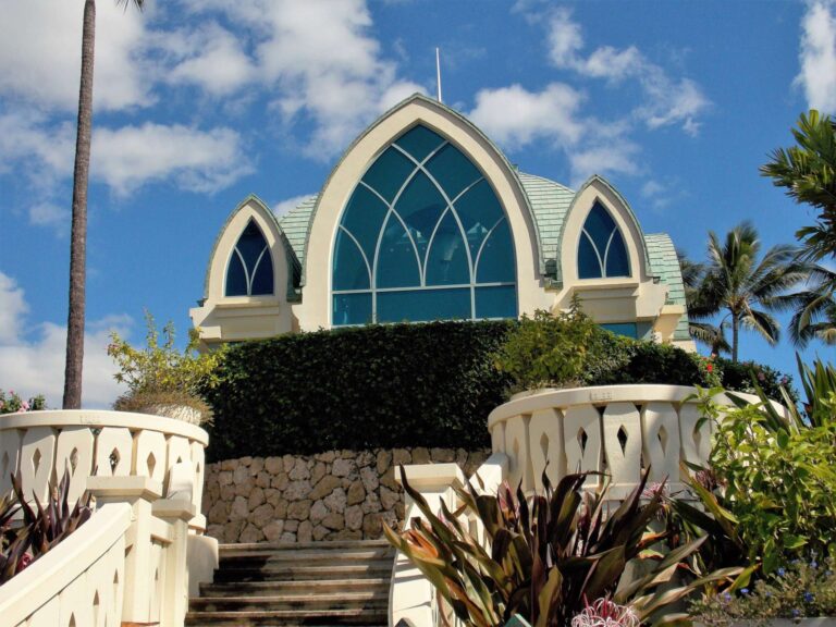 Ko Olina Chapel, a wedding chapel with tall arched blue windows, at the top of a stone stairway at Ko Olina on Oahu