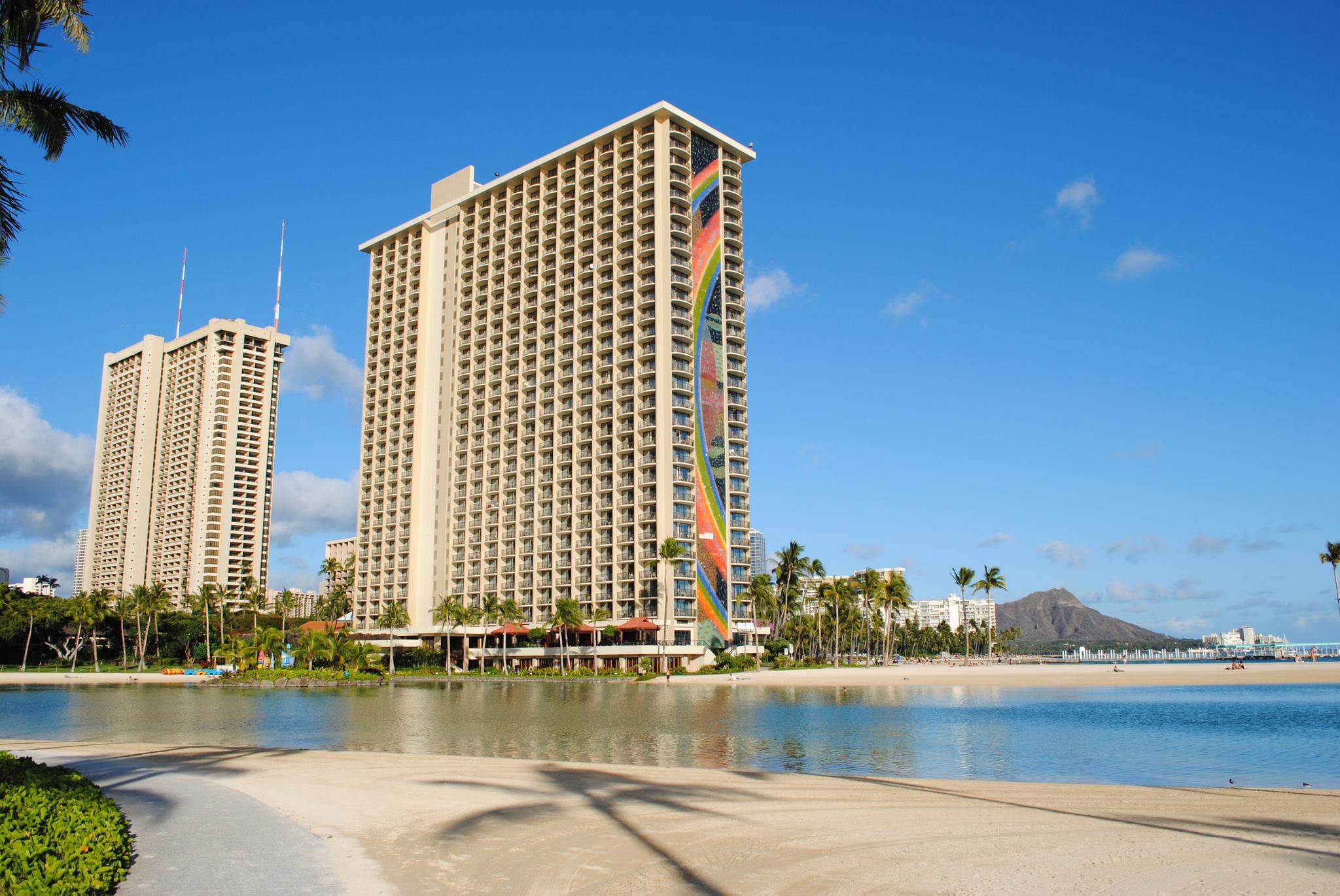 Hilton Hawaiian Village's Rainbow Tower above Duke Kahanamoku Lagoon, with Diamond Head behind