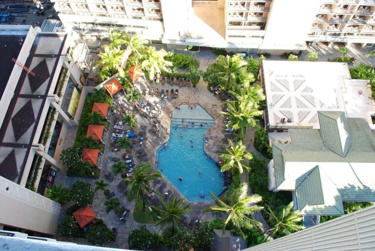 A pool and gardens seen from above at Hilton Hawaiian Village