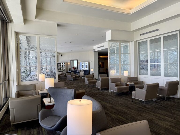 Armchairs and lamps inside the United Club at Honolulu airport