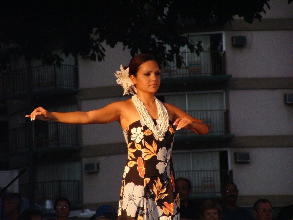 A hula dancer performing at Kuhio Beach Park in Waikiki