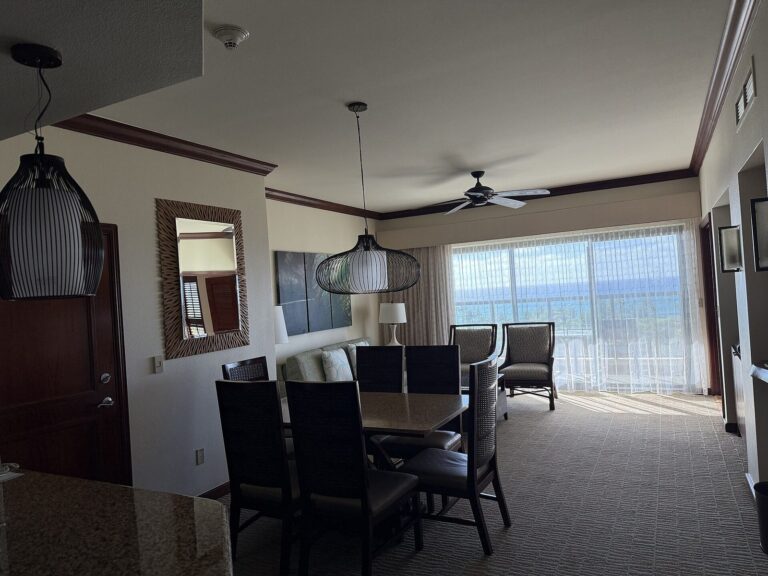 A villa dining and living room with an ocean-view lanai