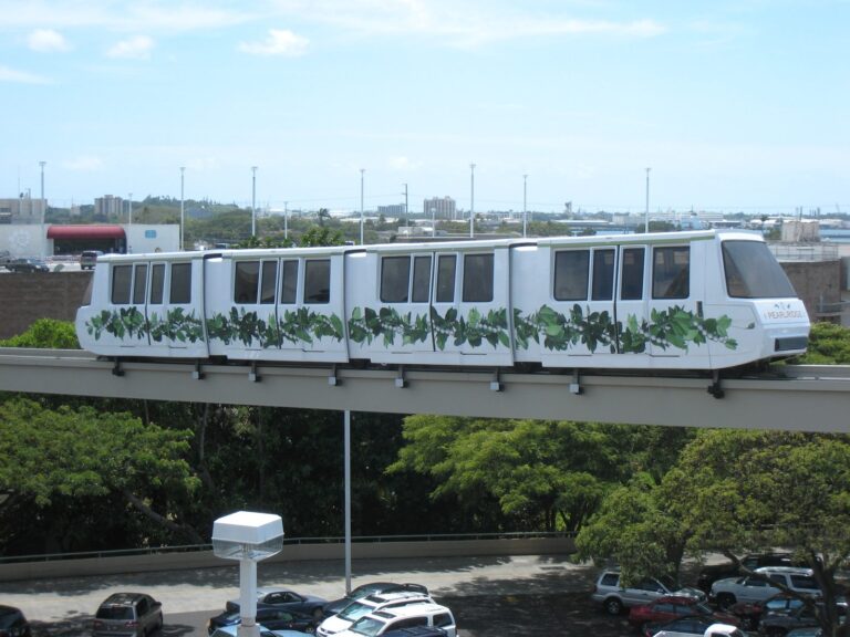 The Pearlridge Skycab monorail car on its elevated track over the parking lot