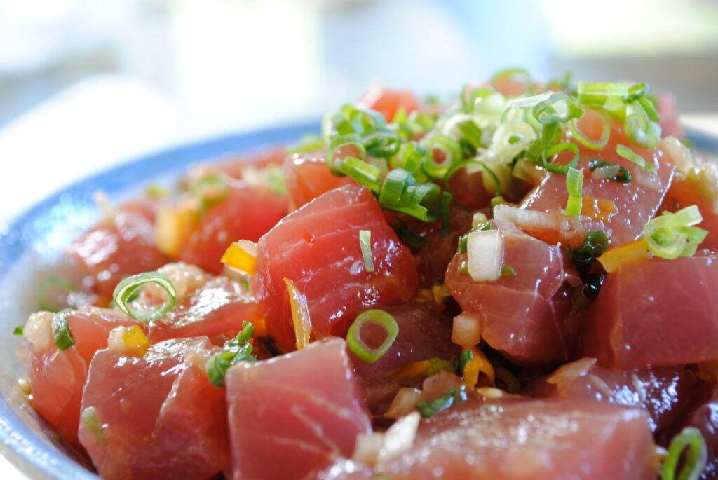 Cubed ahi shoyu poke with green onion and sesame oil