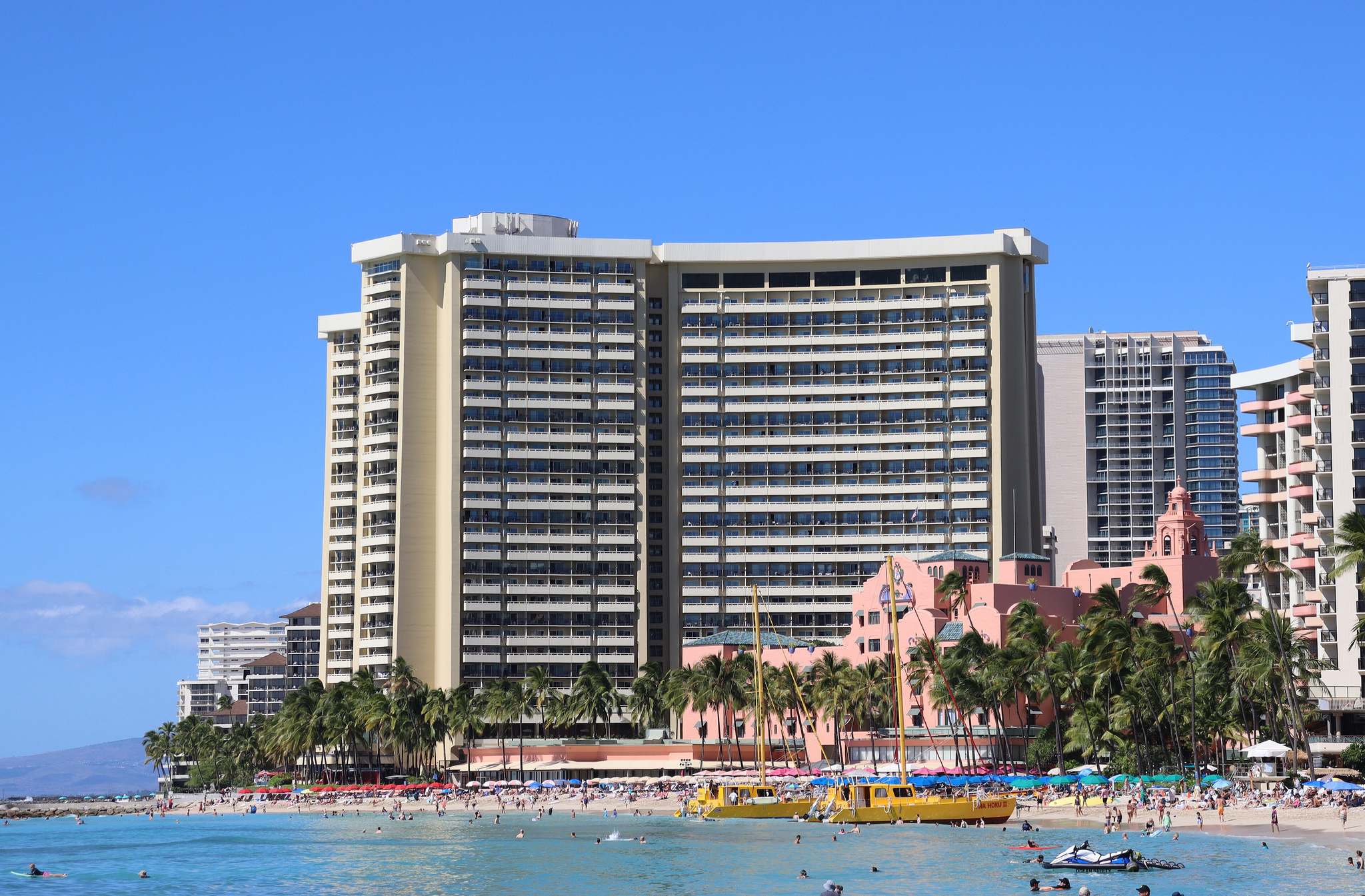 The Sheraton Waikiki tower and the pink Royal Hawaiian seen from Waikiki Beach