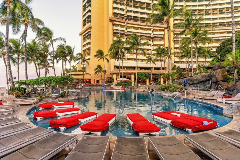 Loungers in the shallows of a pool at the Sheraton Waikiki