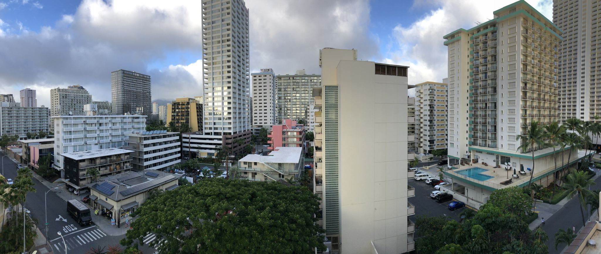 Waikiki hotel towers, side streets and a surface parking lot seen from the upper deck of a Waikiki parking garage
