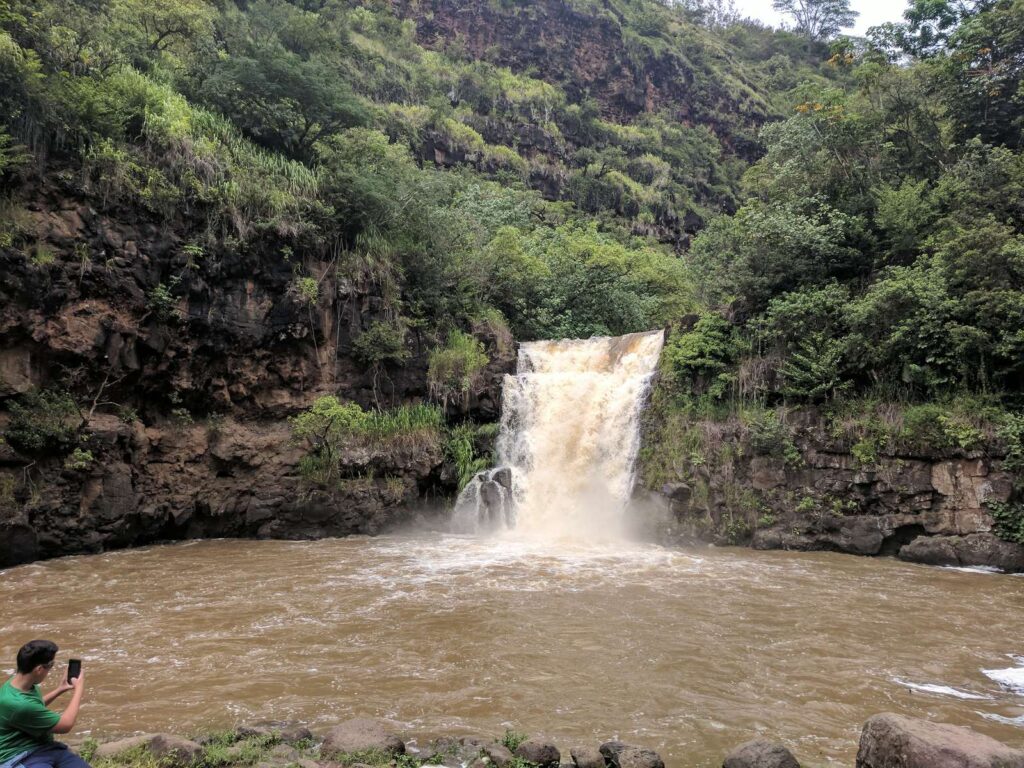 Waimea Falls dropping into its pool at Waimea Valley on Oahu's North Shore