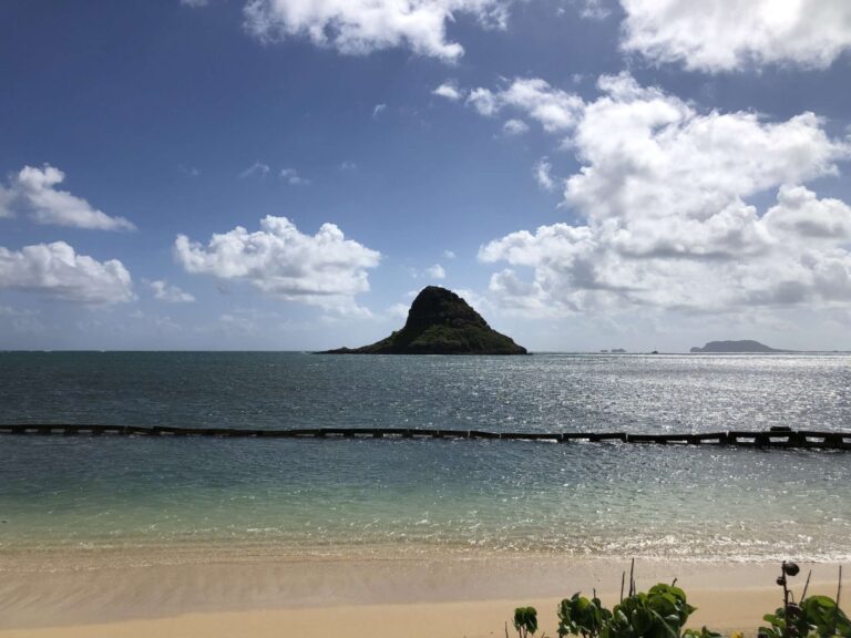 Mokoliʻi rising from Kāneʻohe Bay, seen from the sand at Kualoa Regional Park