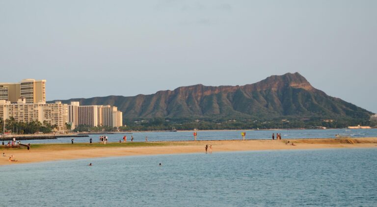 Swimmers in the Magic Island lagoon at Ala Moana Beach Park with Diamond Head behind