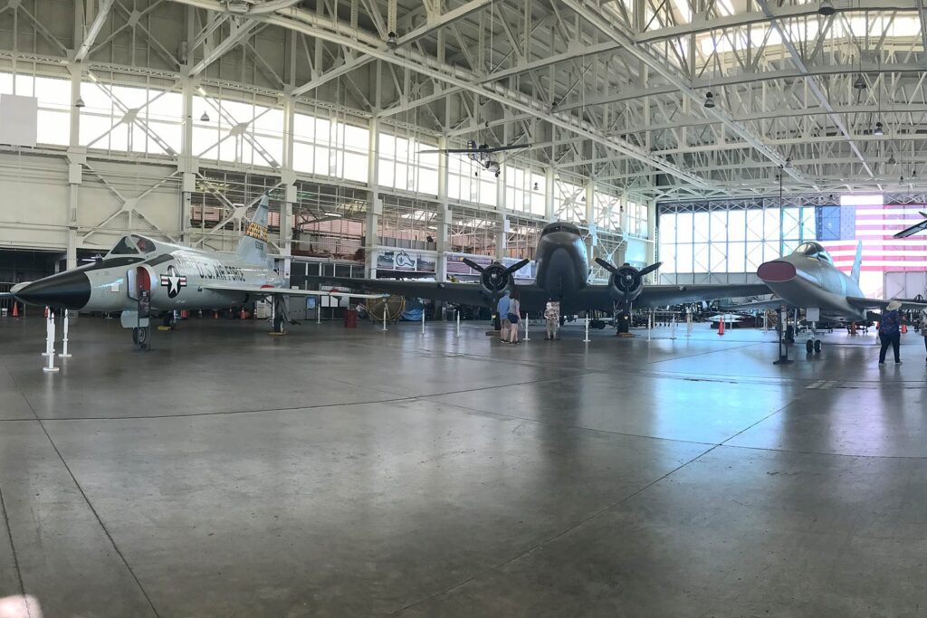 Aircraft on display inside a World War II hangar at the Pearl Harbor Aviation Museum on Ford Island
