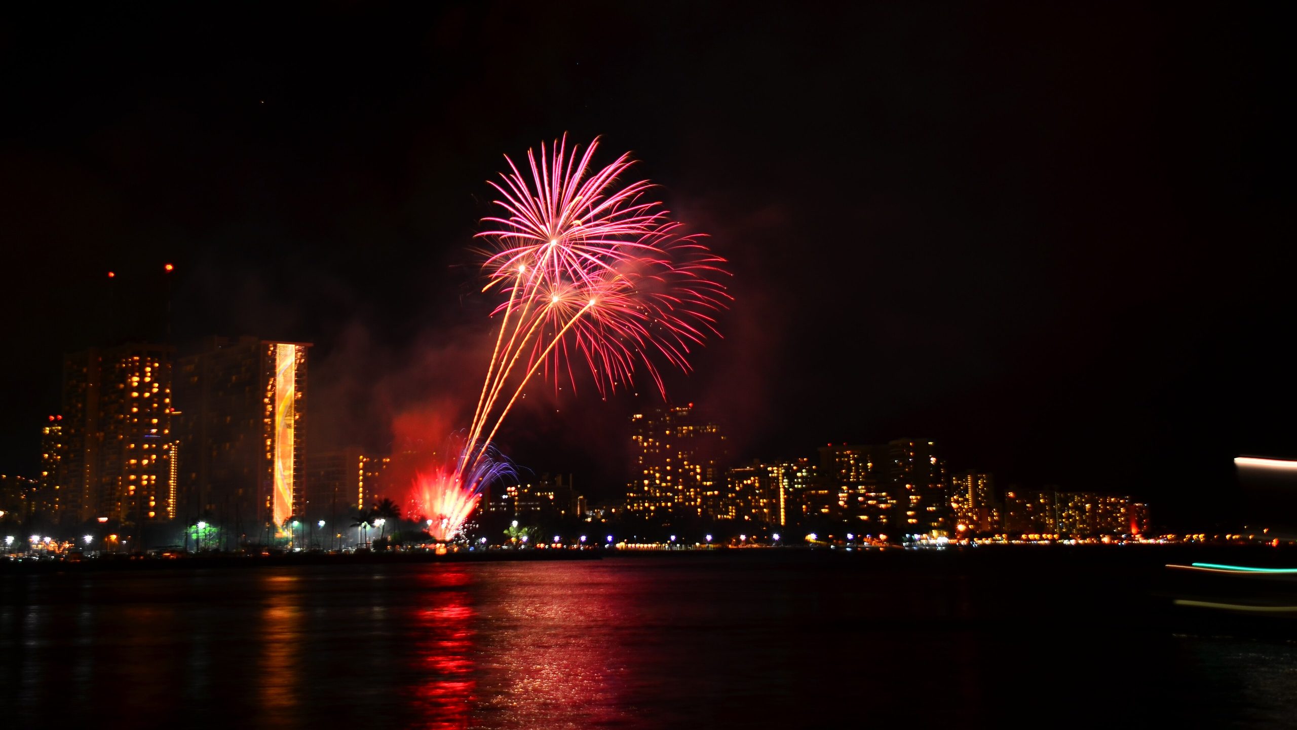 Friday night fireworks bursting over the water in front of Hilton Hawaiian Village’s Rainbow Tower in Waikiki