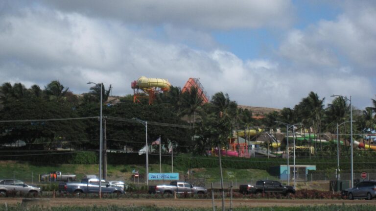 Water slides rising above the trees at Wet'n'Wild Hawaii, seen from Farrington Highway